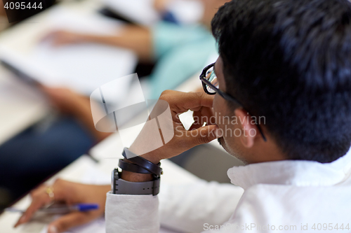 Image of close up of indian student at university lecture 