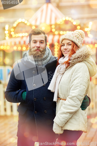 Image of happy couple walking in old town