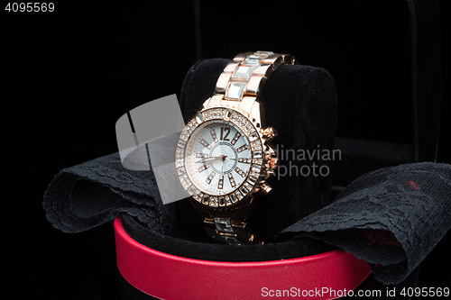 Image of gold watch isolated on black background