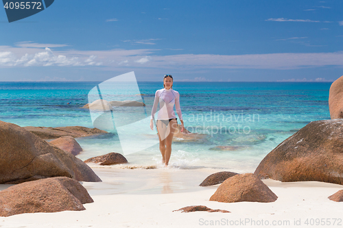 Image of Woman enjoying Anse Lazio picture perfect beach on Praslin Islan