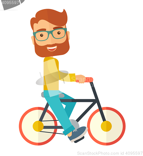 Image of Man riding a bicycle.