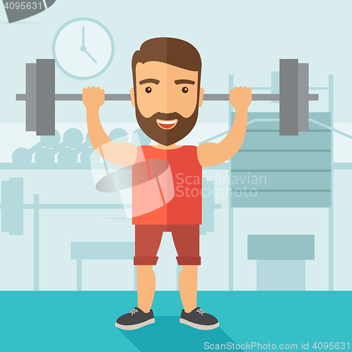 Image of Handsome man lifting a barbell