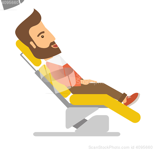Image of Man lying in dentist chair.