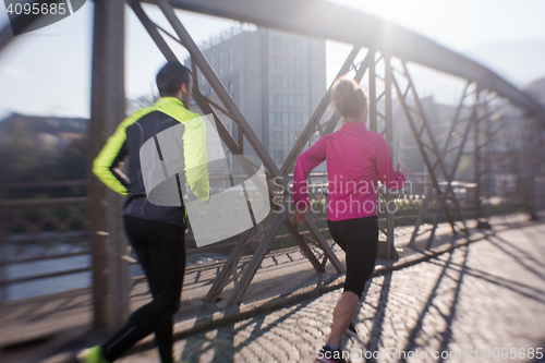 Image of young  couple jogging