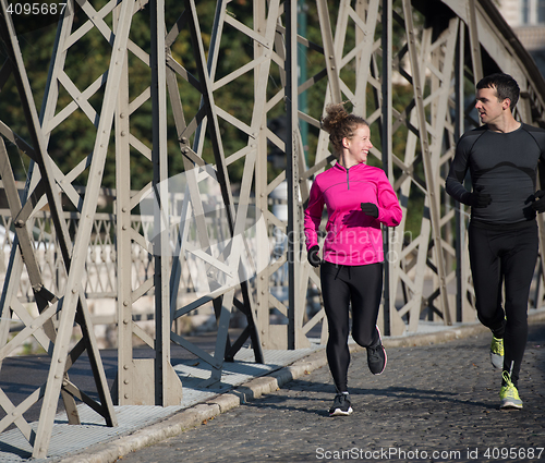 Image of young  couple jogging