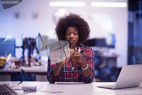 Image of portrait of a young successful African-American woman in modern 