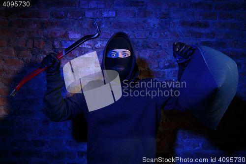 Image of Gangster with master key , bag