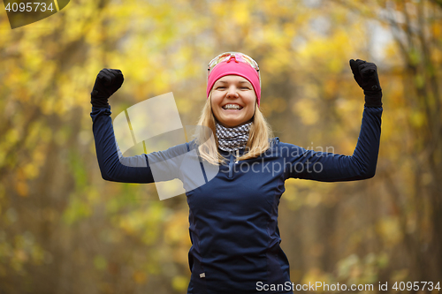 Image of Young sporty woman doing exercises