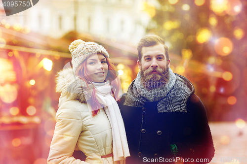 Image of happy couple walking in old town