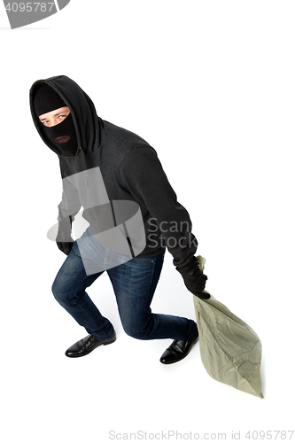 Image of Thief in gloves carries bag