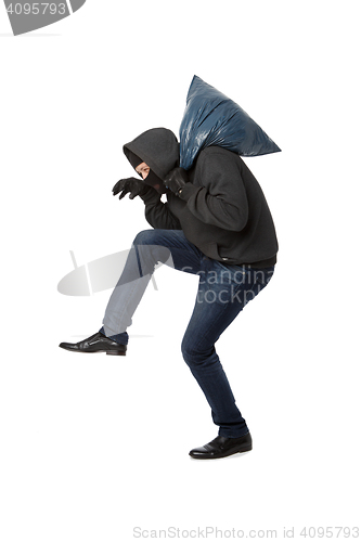 Image of Robber with bag on shoulder