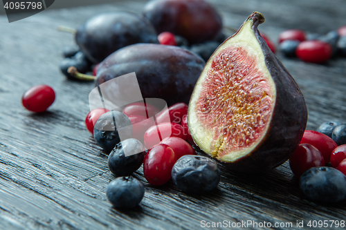 Image of healthy plums, berries and figs