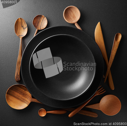 Image of two plates and wooden cutlery
