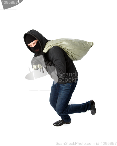 Image of Thief running with heavy bag
