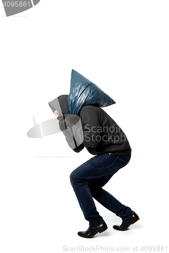 Image of Robber slinking with large sack