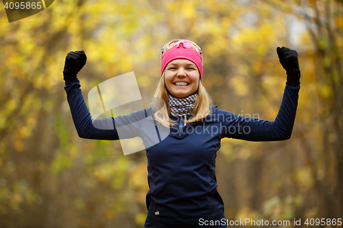 Image of Young smiling girl doing exercises