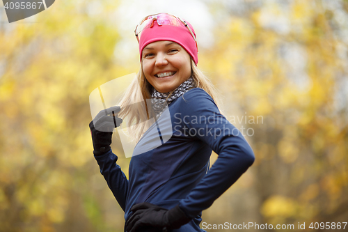 Image of Smiling girl in sport clothes