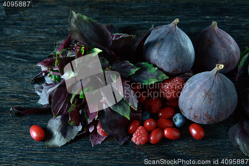 Image of berries bunch, basil and figs