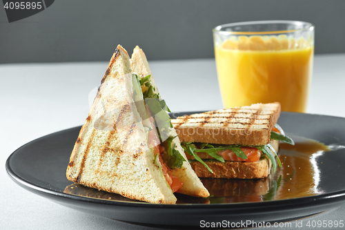 Image of salmon sandwich with juice. Healthy food