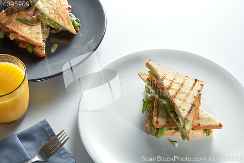 Image of two club sandwich with various fillings