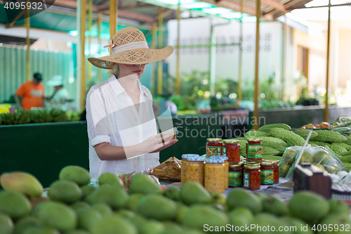 Image of Traveler shopping on traditional Victoria food market, Seychelles.