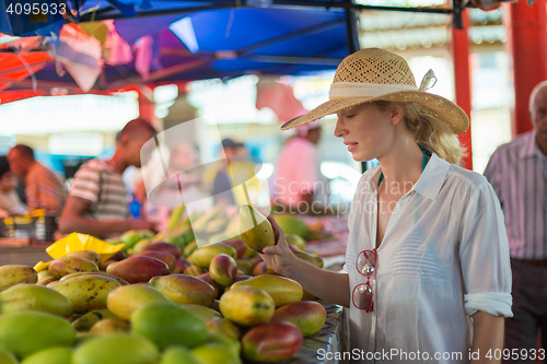 Image of Traveler shopping on traditional Victoria food market, Seychelles.