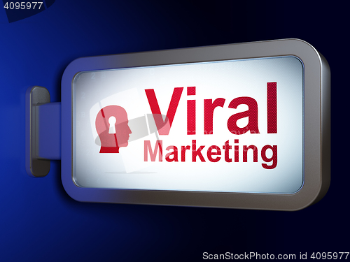 Image of Advertising concept: Viral Marketing and Head With Keyhole on billboard background