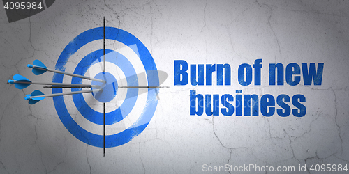 Image of Business concept: target and Burn Of new Business on wall background