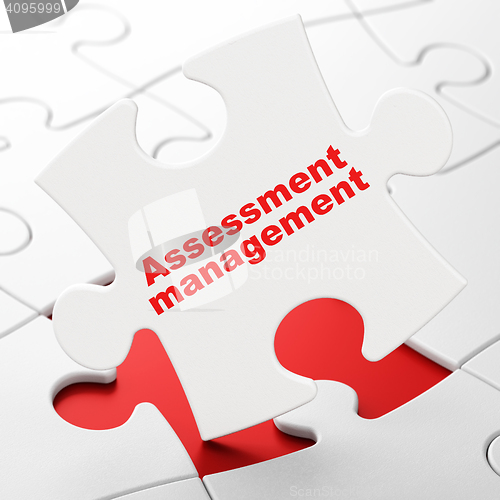 Image of Finance concept: Assessment Management on puzzle background