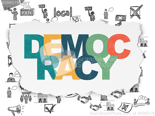 Image of Political concept: Democracy on Torn Paper background