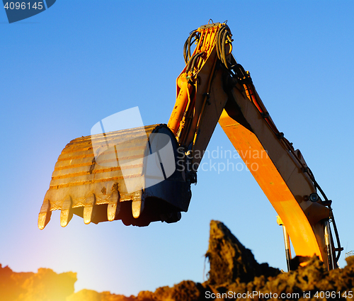 Image of Shovel bucket against blue sky   