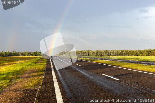 Image of rainbow on the road