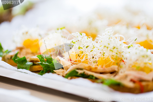 Image of close up of canape or sandwiches on serving tray