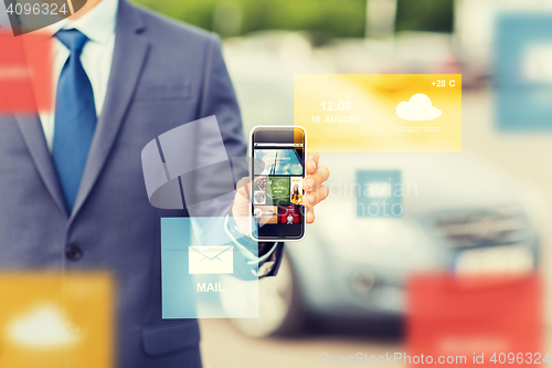 Image of close up of business man with smartphone media