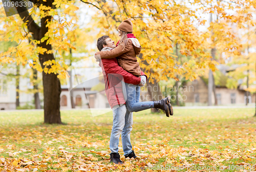 Image of happy young couple meeting in autumn park