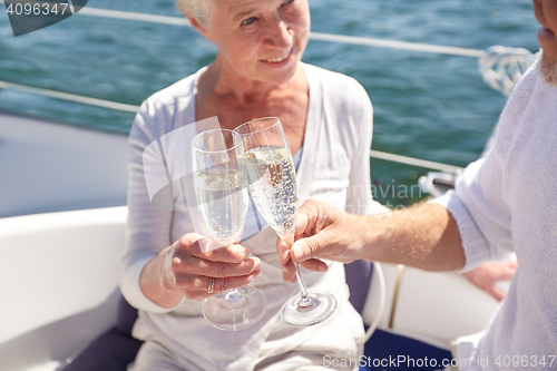 Image of close up of senior couple with champagne on boat