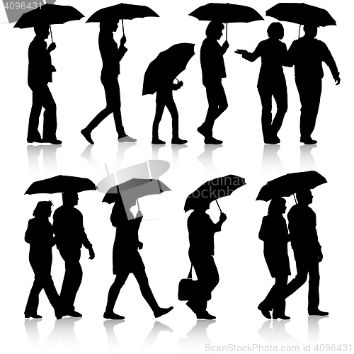 Image of Black silhouettes man and woman under umbrella. 