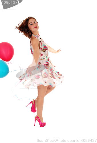 Image of Dancing woman with balloon's.