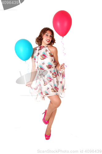 Image of Lovely dancing woman with balloons.