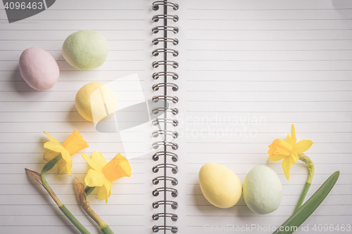 Image of Daffodils and easter eggs on paper