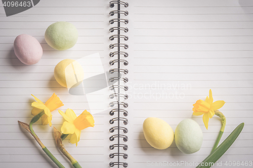 Image of Daffodils and easter eggs on paper