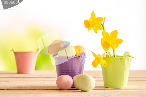 Image of Easter eggs in a purple bucket