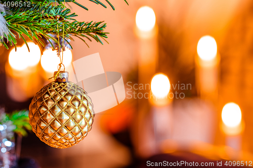 Image of Golden bauble on a Christmas tree