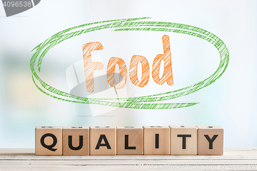 Image of Food quality sign made of wooden cubes