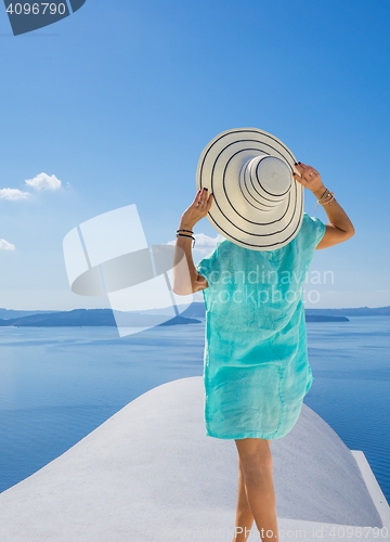 Image of Young woman on holidays, Santorini Oia town 