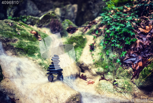 Image of Rock Zen Stack in front of waterfall.