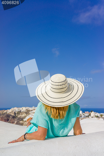 Image of Young woman on holidays, Santorini Oia town 