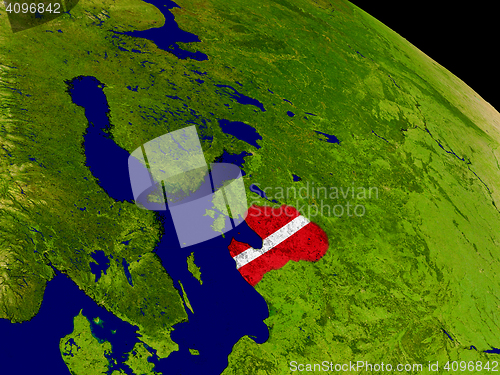 Image of Latvia with flag on Earth