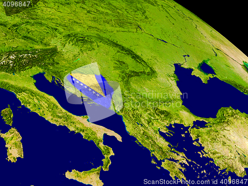 Image of Bosnia with flag on Earth