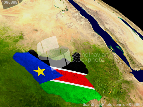 Image of South Sudan with flag on Earth